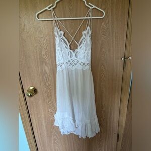 free people one white lacy dress. asymmetric.
